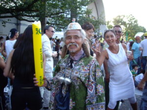 difficult to see but his cap is actually an empty cup of noodles bowl